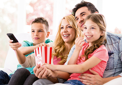 Happy family watching TV